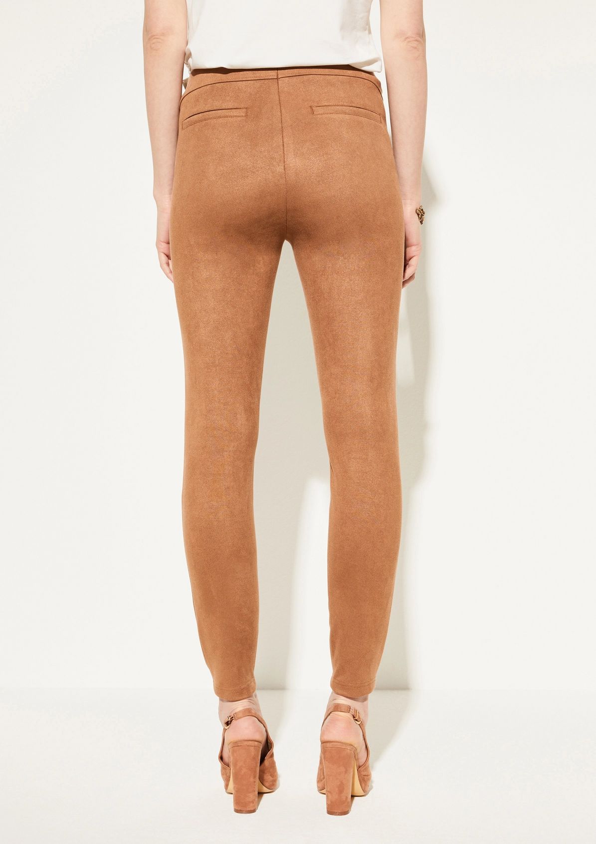 Slim-fitting stretch trousers made of faux suede from comma