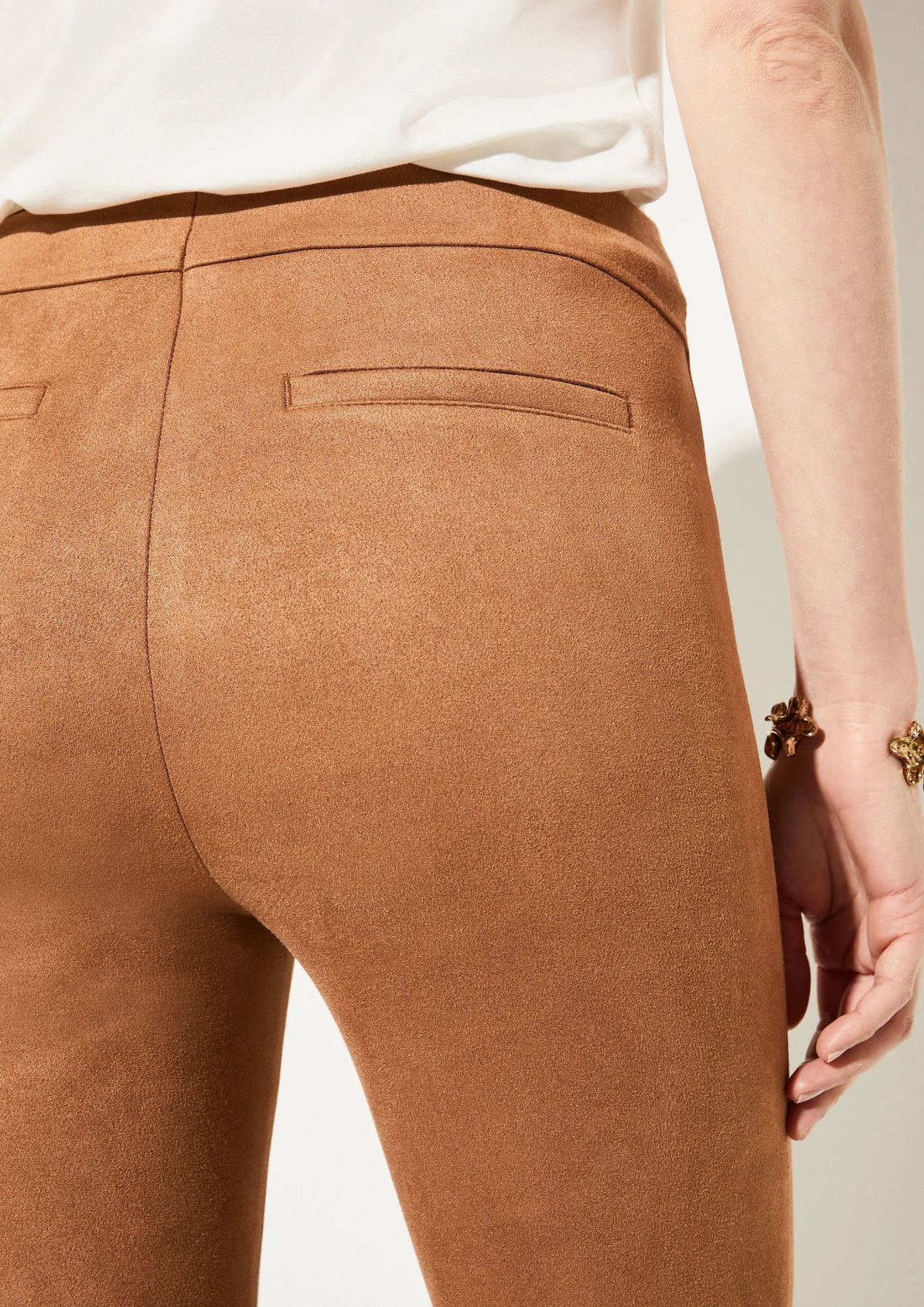 Slim-fitting stretch trousers made of faux suede from comma