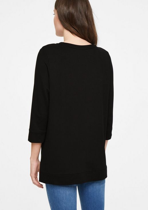 Top with a zip detail from comma