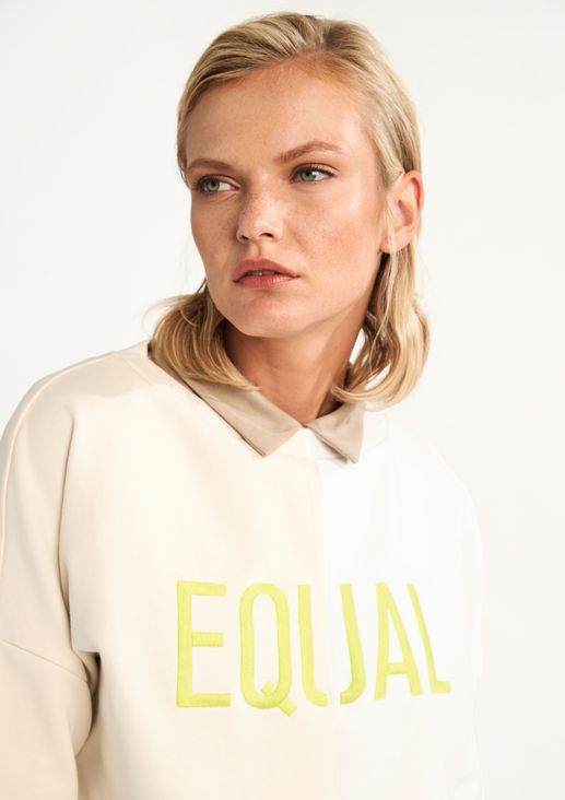 Top with embroidered lettering from comma