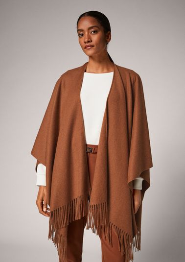 Cape with fringing from comma