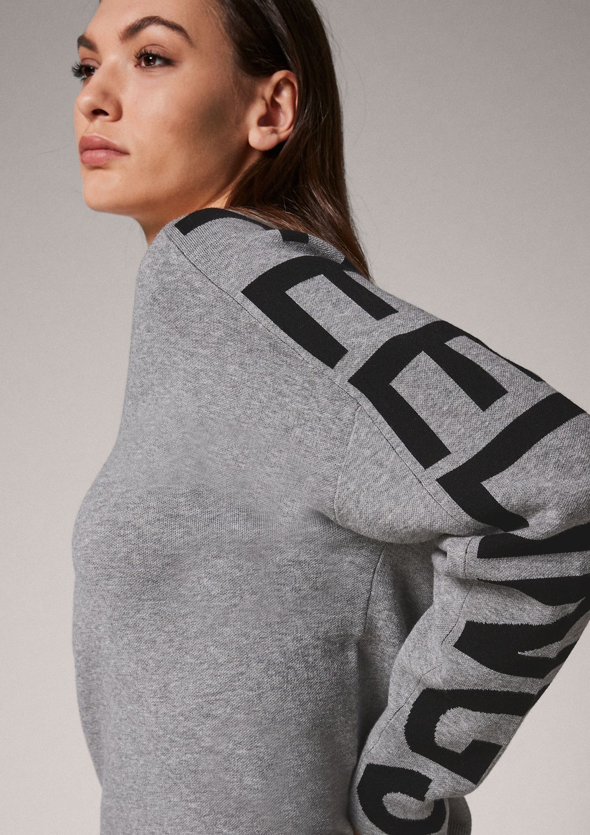 Jumper with lettering from comma