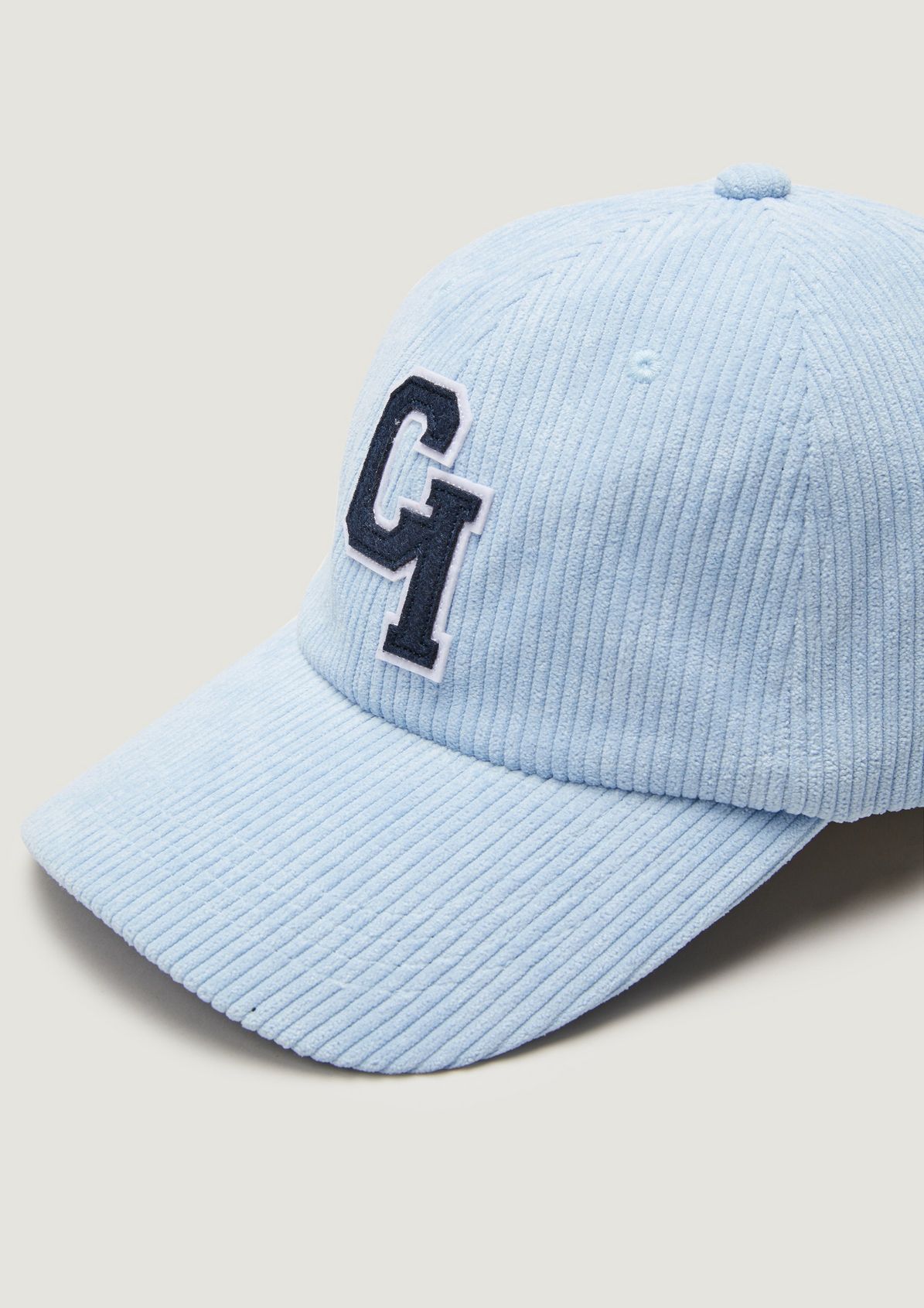 Corduroy cap in a college style from comma