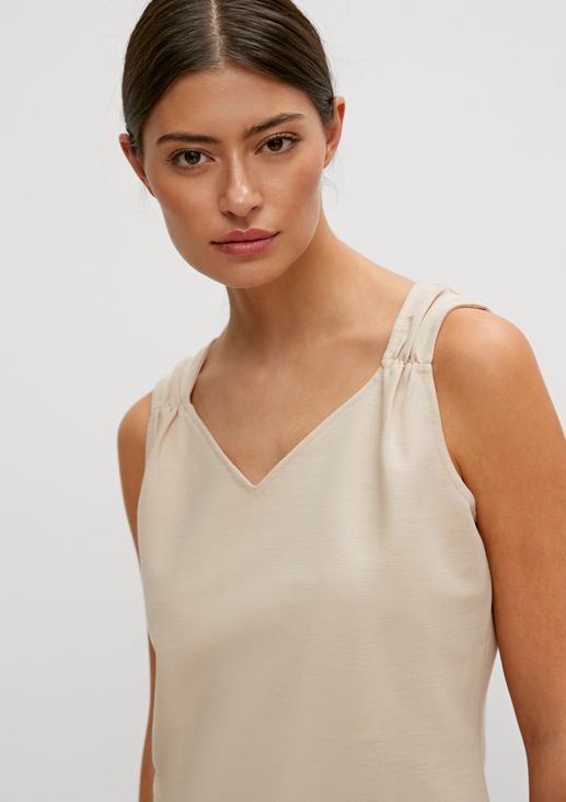 Top with gathered straps from comma