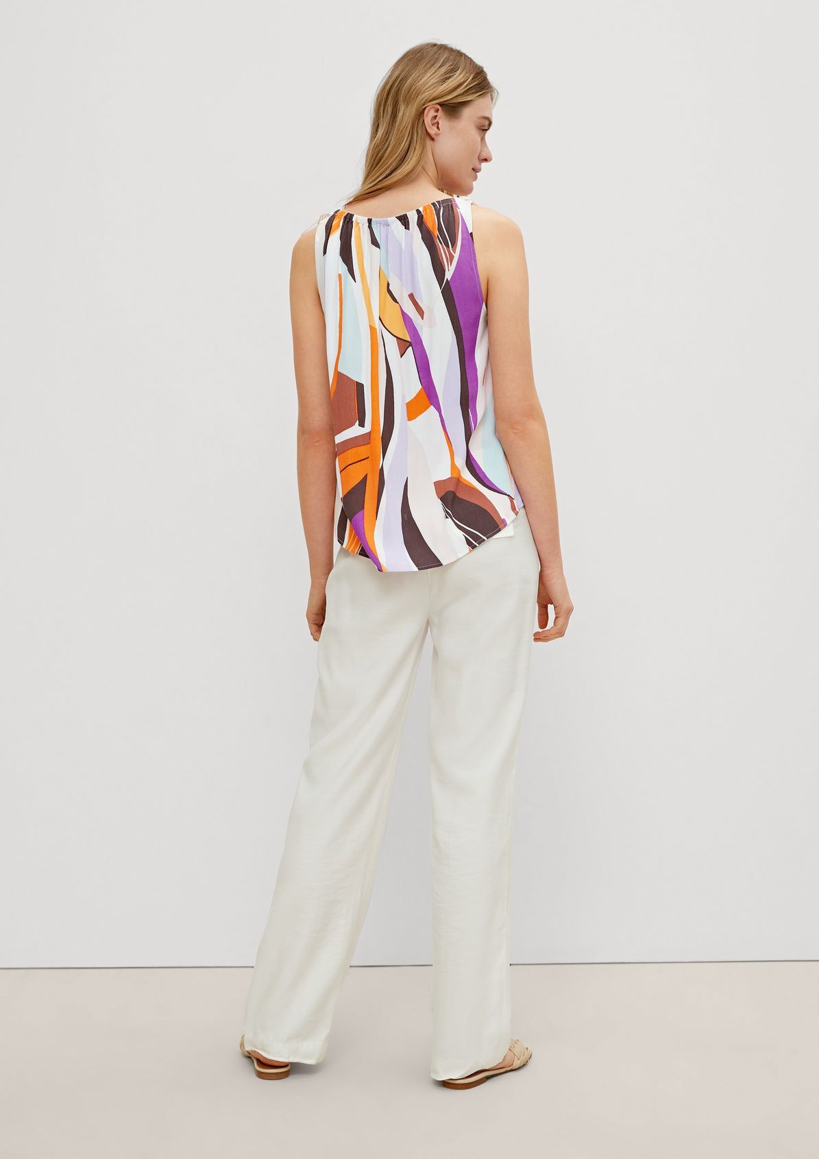 Top with an abstract all-over pattern from comma