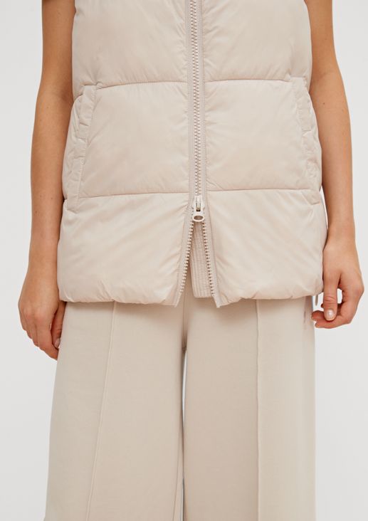 Quilted body warmer with detachable hood from comma