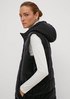 Long quilted body warmer with a hood from comma