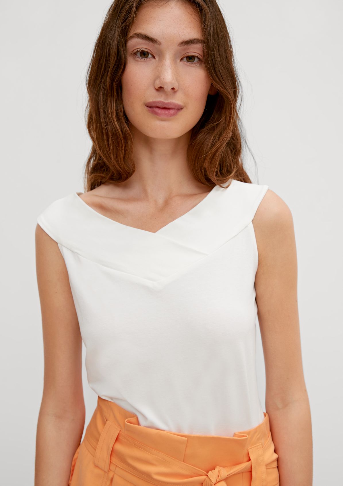 Top with an off-the-shoulder neckline from comma