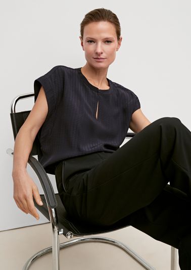 Sleeveless blouse with a notch neckline from comma