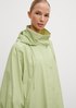 Poncho with a side fastener from comma